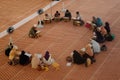 Group of people studying religion inside National Mosque of Malaysia